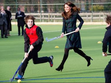The Duchess of Cambridge playing field hockey in heels