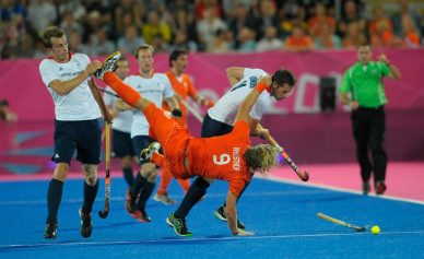 Great Britain's Matt Daly and Iain Lewers combine to foul Netherlands Roderick Wuesthof during their semi-final at the London 2012 Olympic hockey tournament 