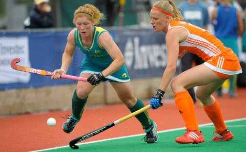 Australia's Georgia Nanscawen is challenged by Netherlands Kitty van Male in the Investec Challenge in South Africa.  Nanscawen scored Australia's second goal.